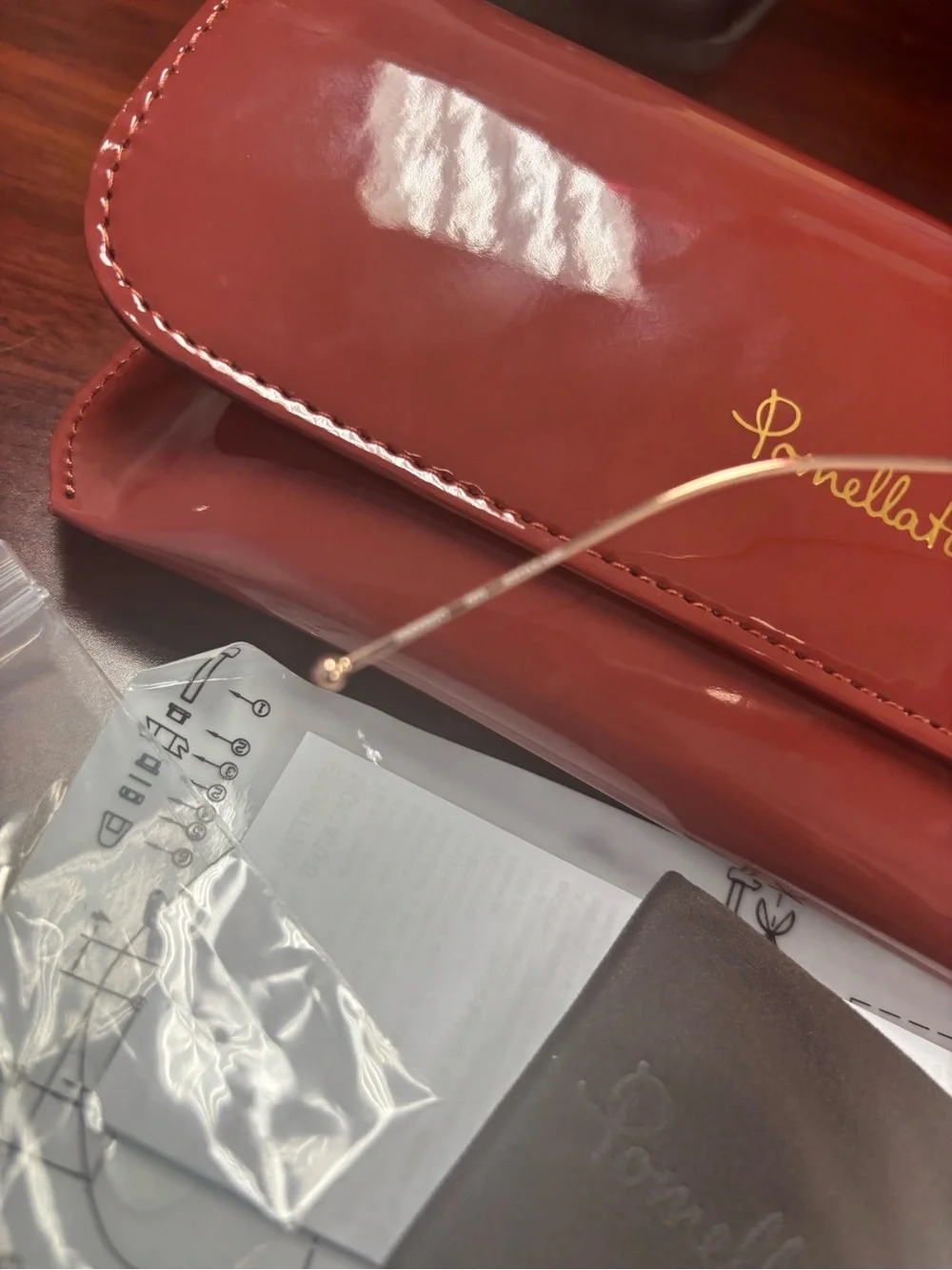 Pomellato Gold Rimless Glasses with Red Case